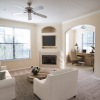 living room with a large window and open spaces